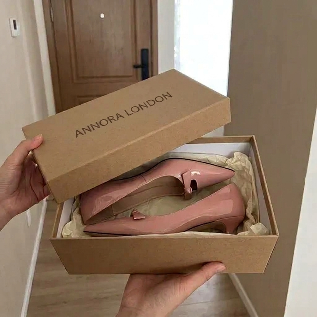 Open ANNORA LONDON box holding a pair of pink patent court shoes